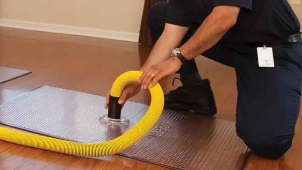 Field technician bringing diagnostic equipment into a home for an on-site visit