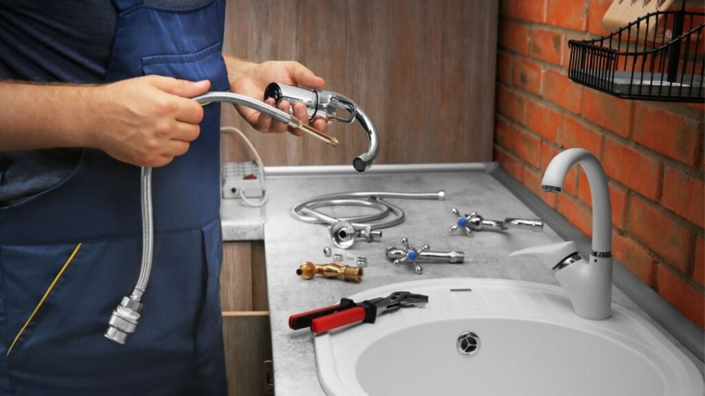 A plumber providing emergency plumbing repair service with relevant tools.
